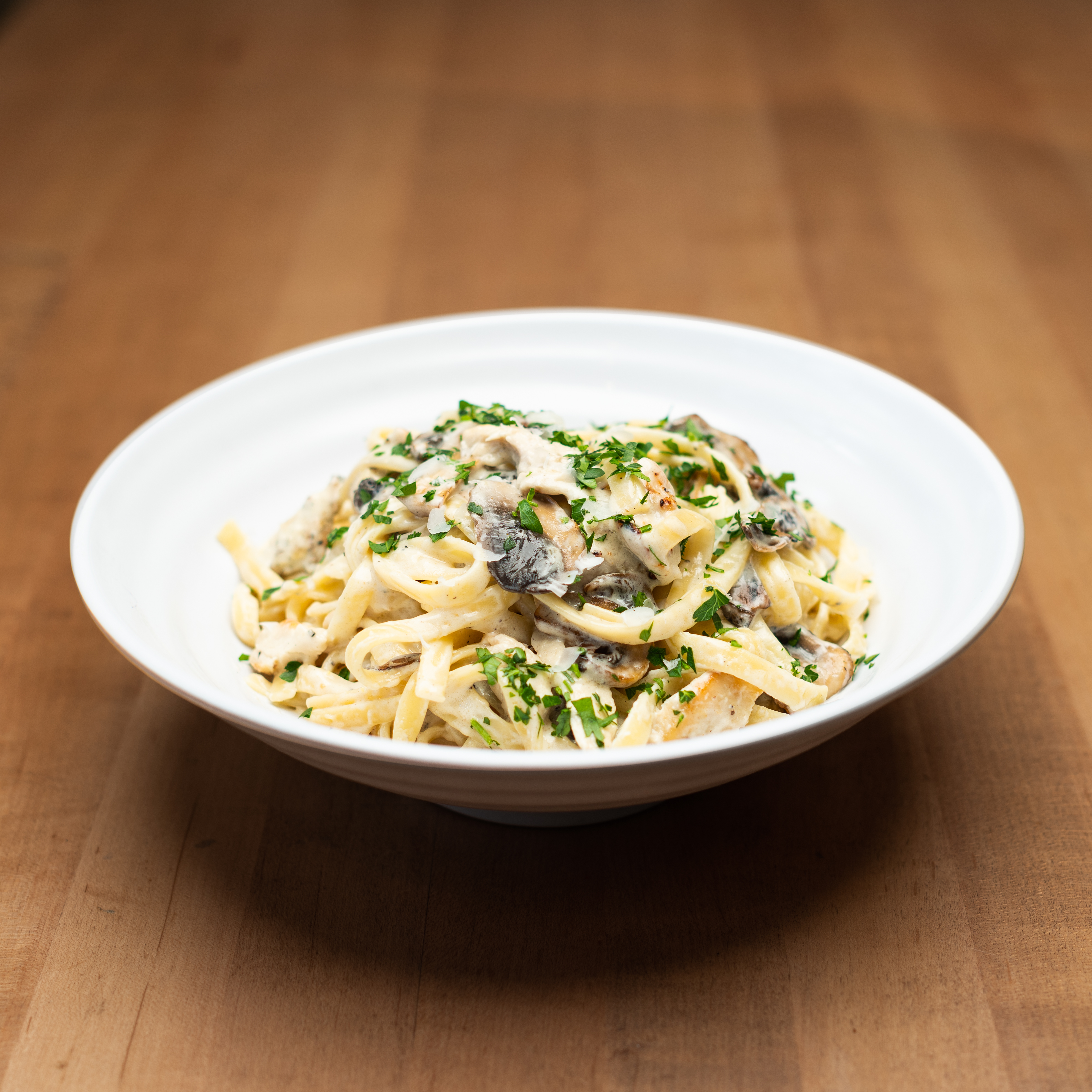 Fettuccine Gambino - Our signature Alfredo sauce tossed with fettuccine...